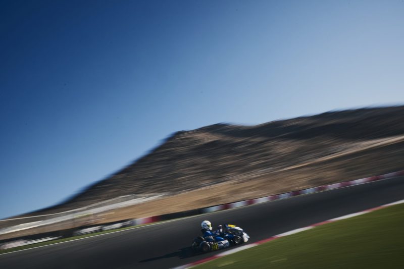 Reid Eck kart #221 on the back section at Winchester with the hills behind